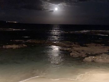 Scenic view of sea against sky at night