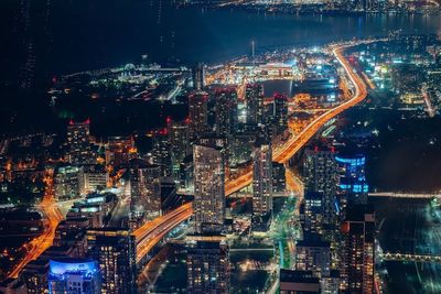 Aerial view of illuminated city at night