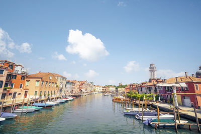 Boats moored at harbor