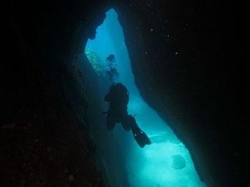 Person scuba diving in sea