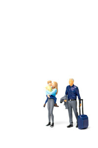 Rear view of friends with toy against white background