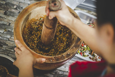 Midsection of man preparing food in kitchen