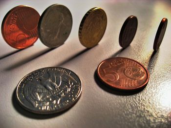 Close-up of coins on table