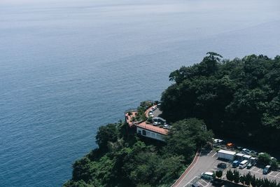 High angle view of trees by sea