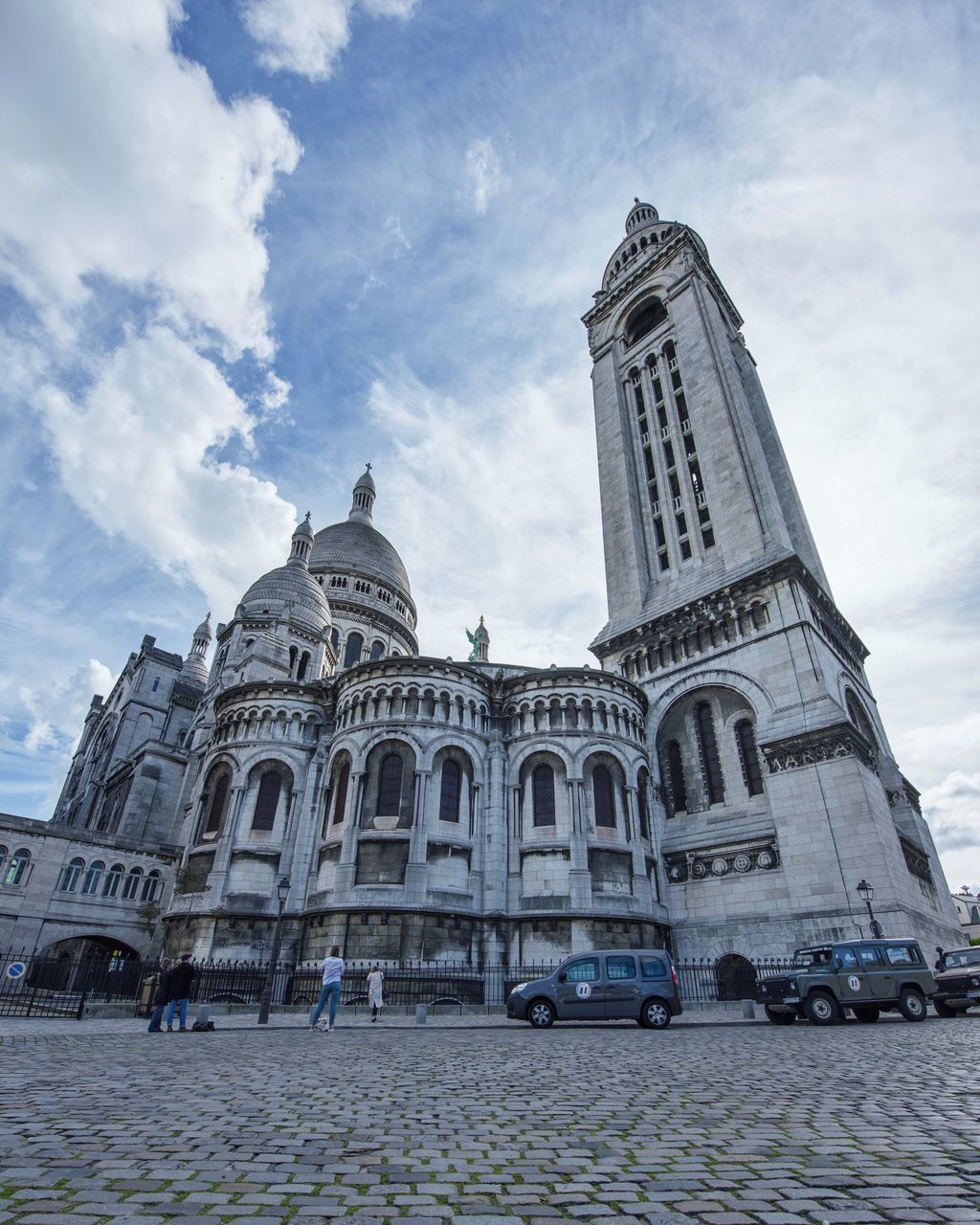 religion, architecture, spirituality, built structure, sky, cloud - sky, place of worship, building exterior, history, low angle view, day, travel destinations, travel, outdoors, dome, transportation, no people