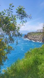 Scenic view of sea against blue sky