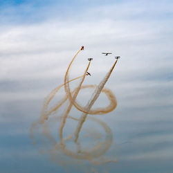 Airplane flying against sky