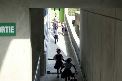 People walking in corridor of building