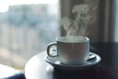 Close-up of coffee cup on table