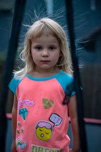 Portrait of cute girl standing outdoors