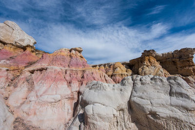 Landscape of white, pink and yellow rock formations at interpretive paint mines in colorado