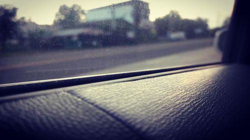 Close-up of wet car windshield on rainy day