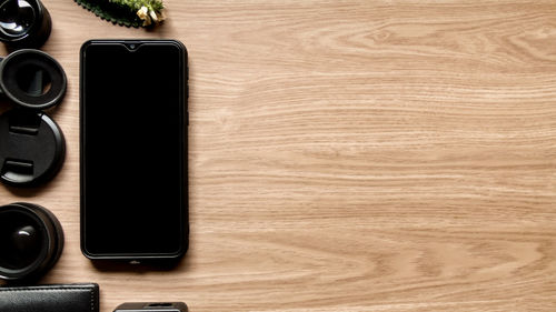 High angle view of smart phone on table