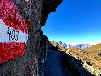 Scenic view of mountain against blue sky