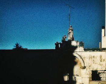 Low angle view of church against blue sky