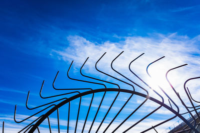 Low angle view of metal structure against sky