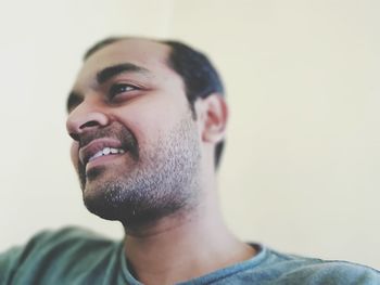 Close-up portrait of young man looking away