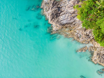 High angle view of rocks in sea