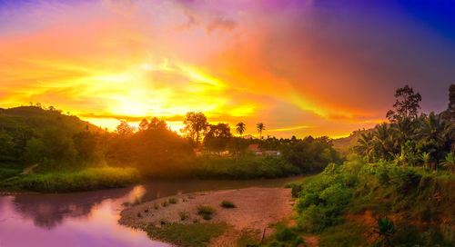 Scenic view of lake against orange sky