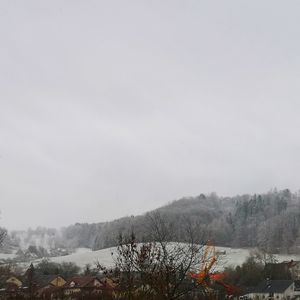 Scenic view of mountains against sky during winter