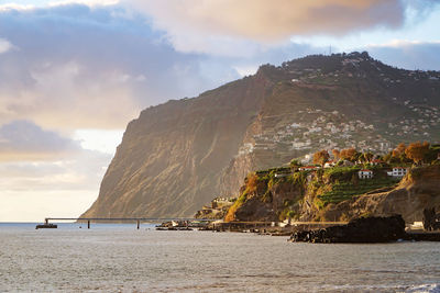 Scenic view of bay against sky