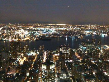 Aerial view of illuminated cityscape at night