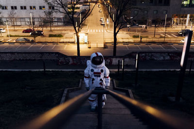 Rear view of man walking on street