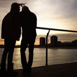 Silhouette of woman at sunset