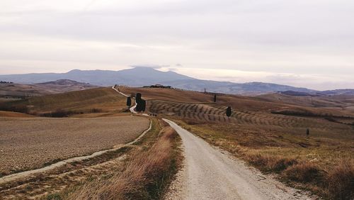 Scenic view of road on mountain against sky