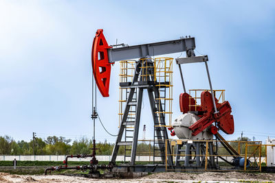 Extraction of crude oil in oilfield. oil drilling rig pumps oil. petroleum industry, oil