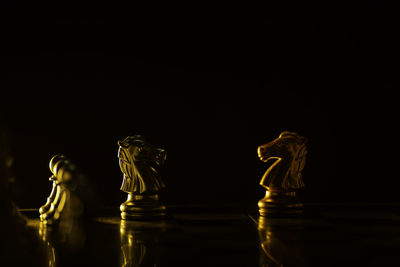 Close-up of chess against black background