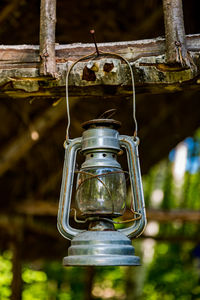 Close-up of electric lamp hanging on ceiling