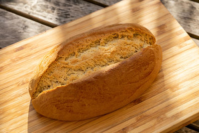 High angle view of bread on cutting board