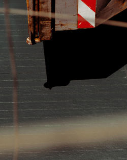 Low section of people walking on wet street