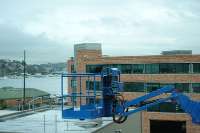 View of buildings against cloudy sky