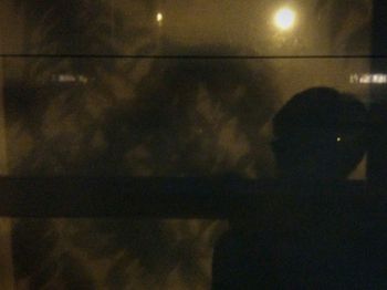 People on illuminated lights at night