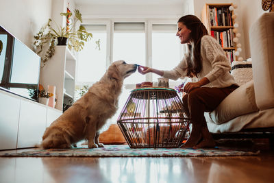 Friends sitting on table at home