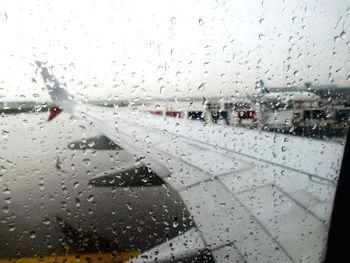 Close-up of wet glass window in rainy season