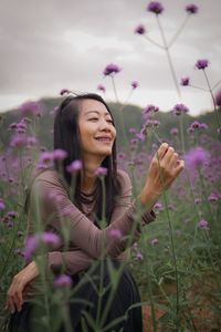 Portrait of young woman using mobile phone