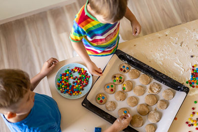 Sibling preparing food at home