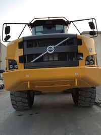 View of yellow car on road