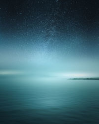 Scenic view of sea against sky at night