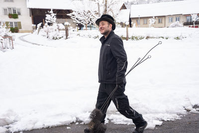 Full length of young man skiing on snow