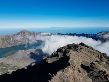 Panoramic view of volcanic landscape against blue sky