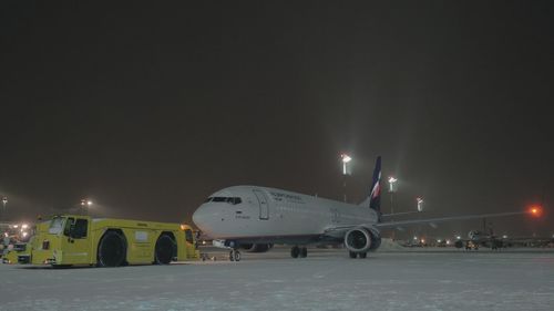 Airplane against sky at night