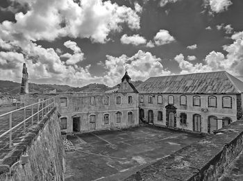 Old building against cloudy sky