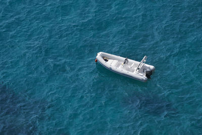 High angle view of boat in calm blue sea