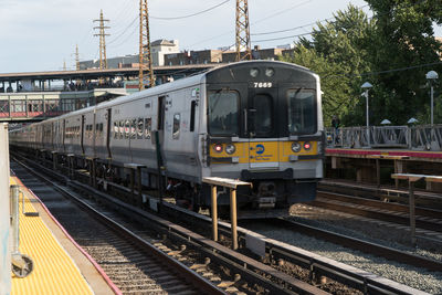 Train at railroad station against sky