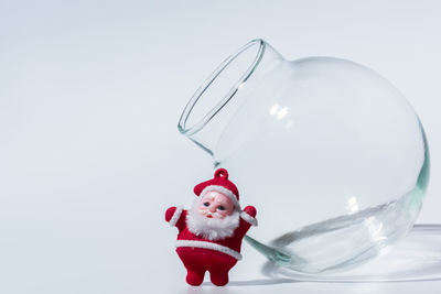 Close-up of christmas decorations over white background