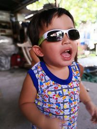 Close-up portrait of boy wearing sunglasses